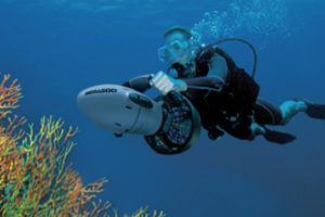 Diver using a modern underwater scooter