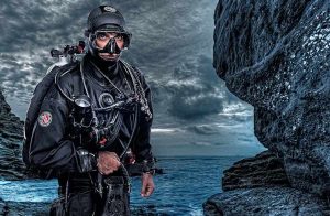 A man wearing a dry diving suit