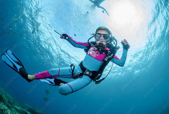 Young girl with a colorful scuba suit