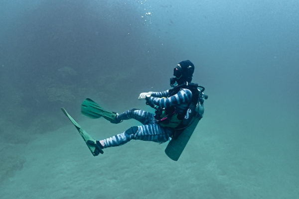 diver floating -Diver submerged practices neutral bouyancy