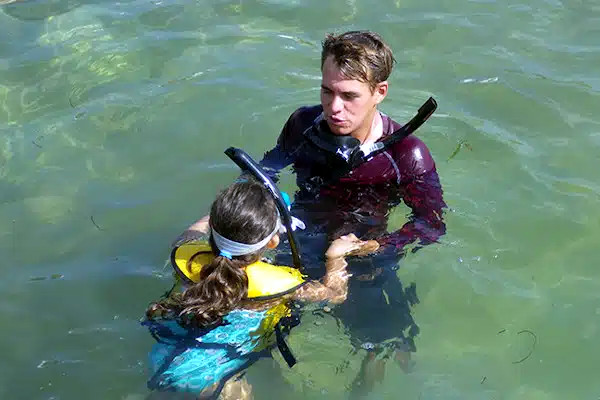 Little girl learning to swim