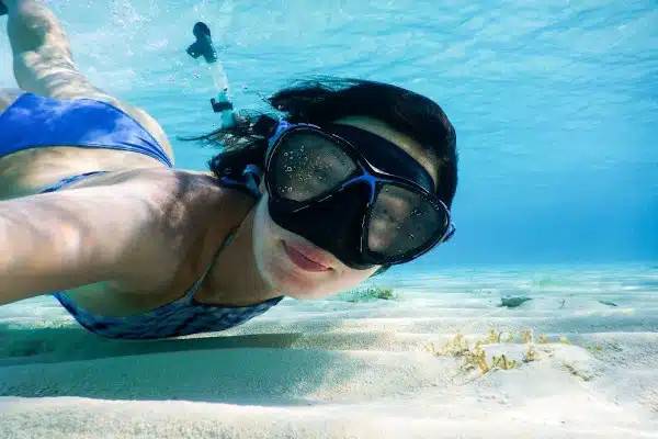 woman swimming underwater