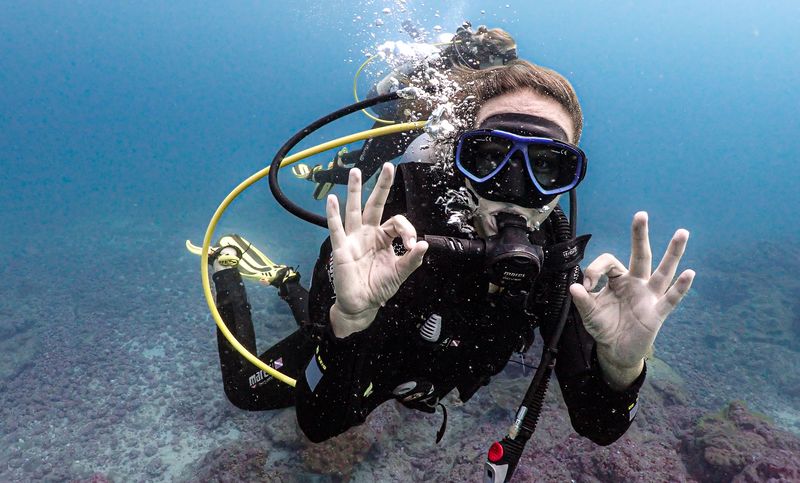 All ok diver sign at Caño Island