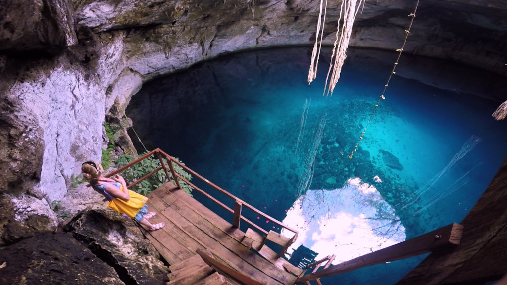 woman admiring a cenote