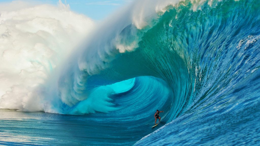 Surfer in a huge wave