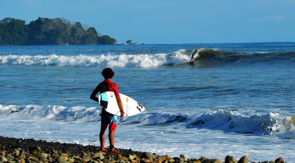 surfer looking at dominical beach