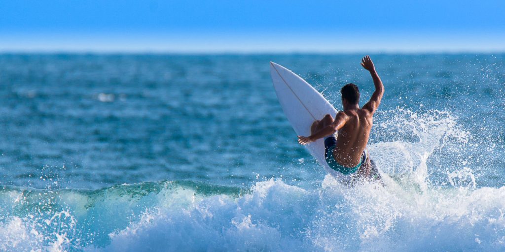 a man surfing in the ocean